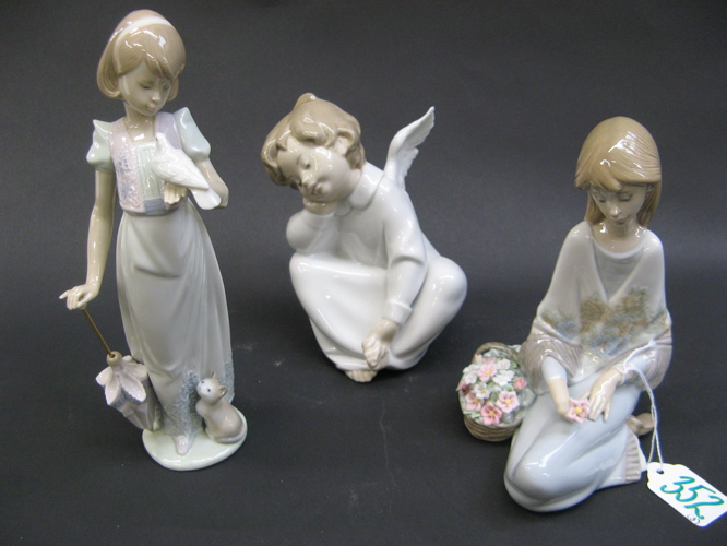 Appraisal: THREE SPANISH LLADRO GLAZED PORCELAIN FIGURES including Summer Stroll -