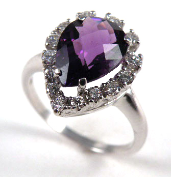 Appraisal: AMETHYST AND FOURTEEN KARAT GOLD RING set with a pear