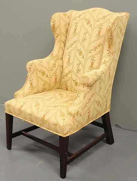 Appraisal: Child's Chippendale style wing chair with yellow floral upholstery and