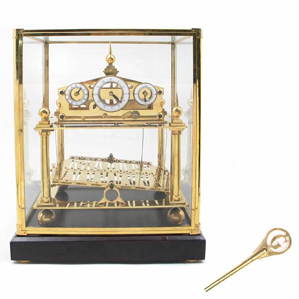 Appraisal: A brass rolling ball clock height in width in