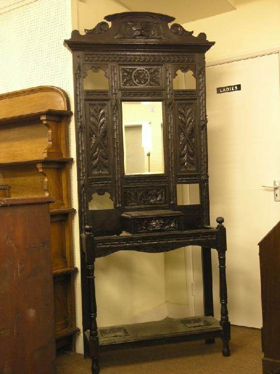 Appraisal: A late Victorian dark carved oak hallstand with grotesque mask