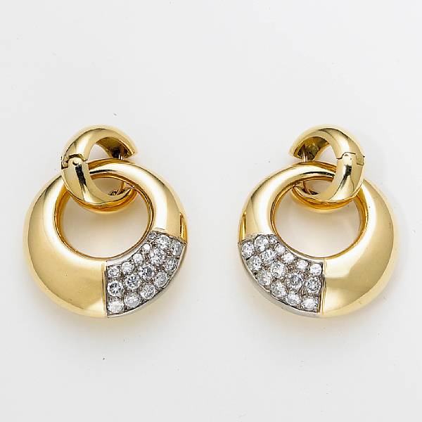 Appraisal: A pair of diamond doorknocker design earrings estimated total diamond