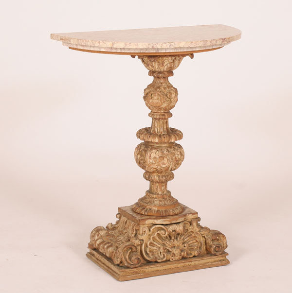 Appraisal: Continental demi lune marble top table robust carved baluster base