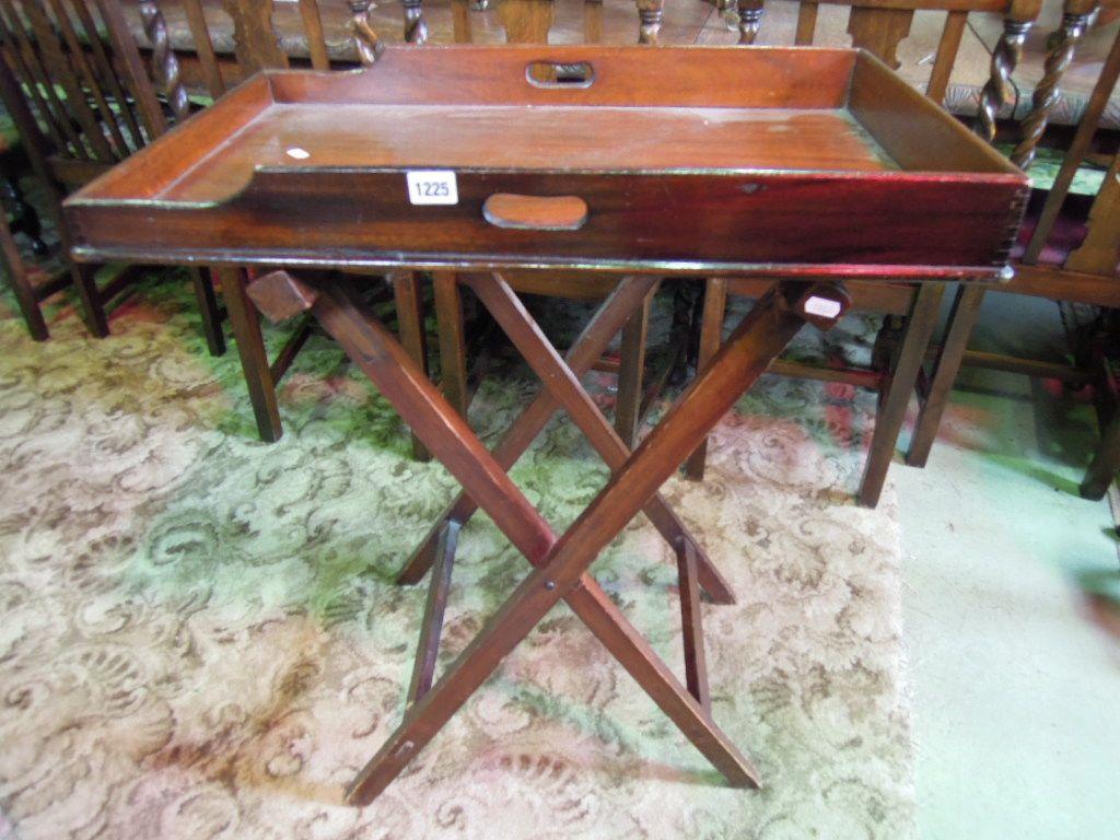 Appraisal: A mahogany butlers tray and folding stand