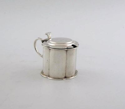 Appraisal: An Edwardian mustard pot hexafoil the lid engraved and crest