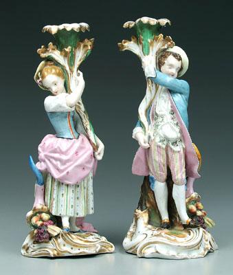 Appraisal: Pair porcelain figural candlesticks young man and woman holding floral