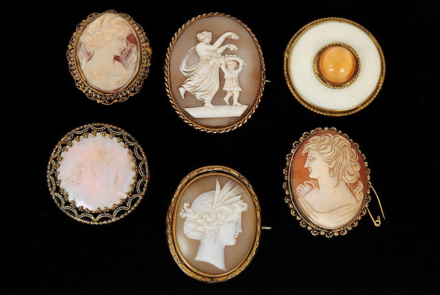 Appraisal: Three cameo brooches depicting female portraits one cameo brooch depicting