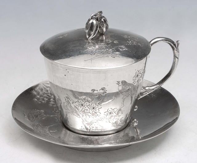 Appraisal: A CHINESE WHITE METAL LIDDED CUP and saucer with floral