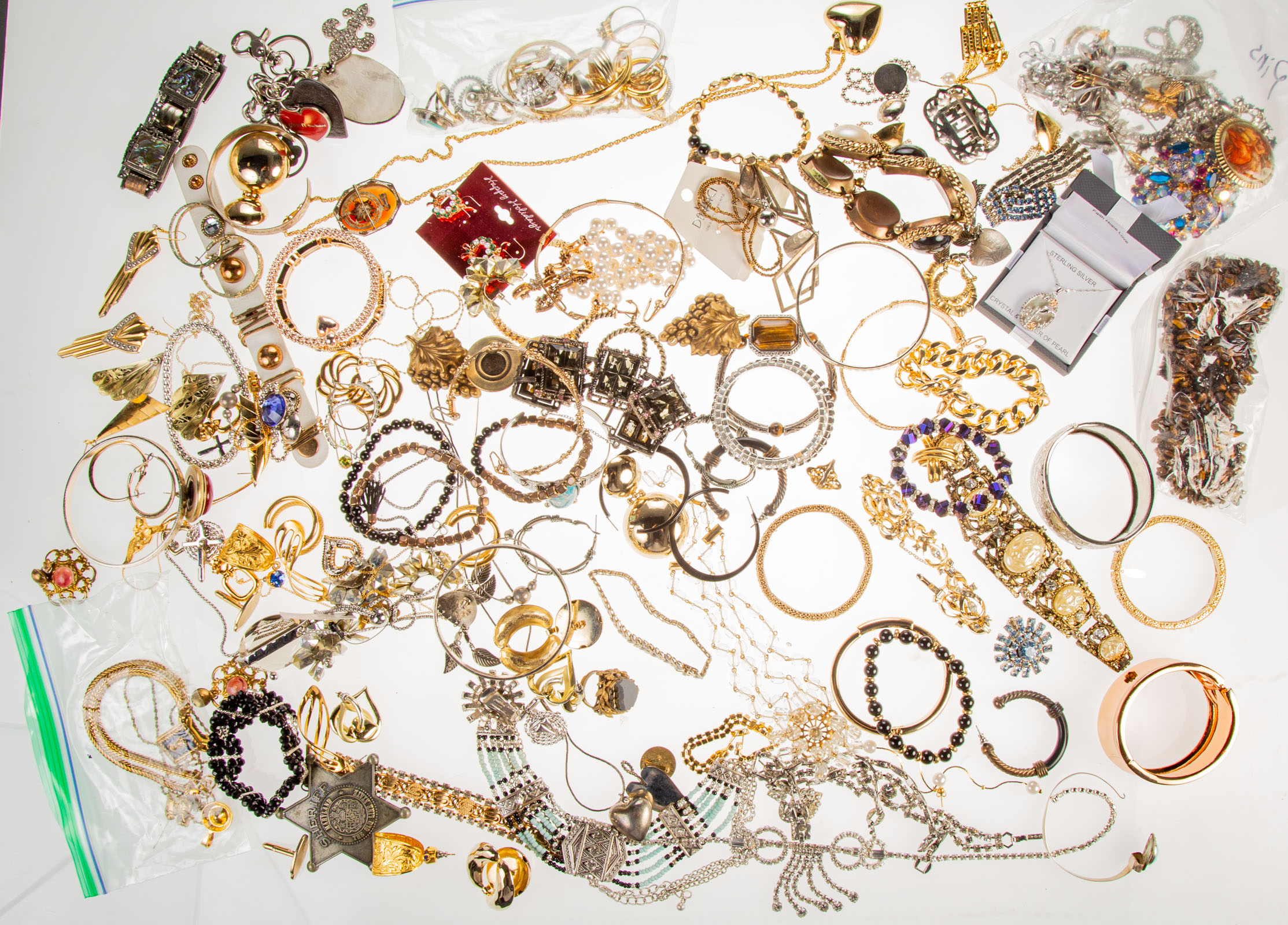 Appraisal: AN ASSORTMENT OF COSTUME JEWELRY Includes silver and gold toned