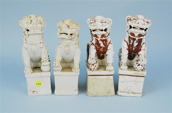 Appraisal: TWO PAIR CHINESE SEATED FOO DOGS one pair with glaze