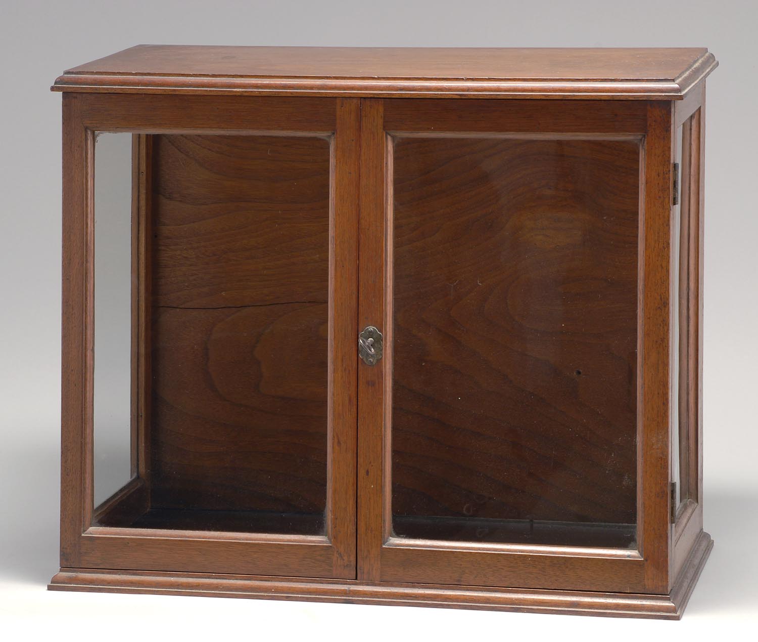 Appraisal: TWO-DOOR CABINET in walnut with molded top and base Height