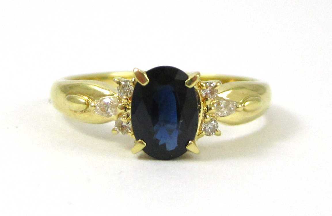 Appraisal: SAPPHIRE DIAMOND AND EIGHTEEN KARAT GOLD RING with two round-cut