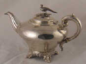 Appraisal: A Victorian silver teapot of inverted pyriform shape with ribbed