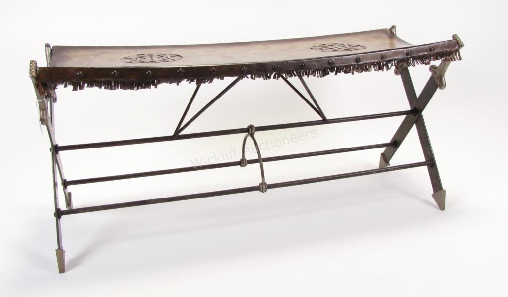 Appraisal: A decorator-quality leather bench cast metal base with crossed-sword motif