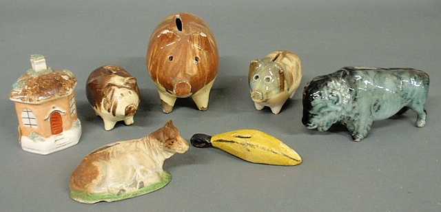 Appraisal: Seven ceramic banks- three piggy banks rare chalkware cow buffalo