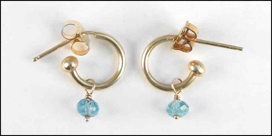 Appraisal: PAIR OF FACETED BLUE TOPAZ AND GOLD EARRINGS Condition No