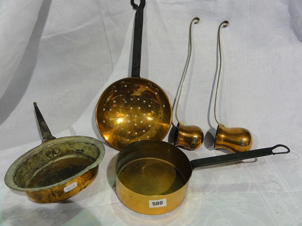 Appraisal: A small selection of copper kitchenalia including a sieve two