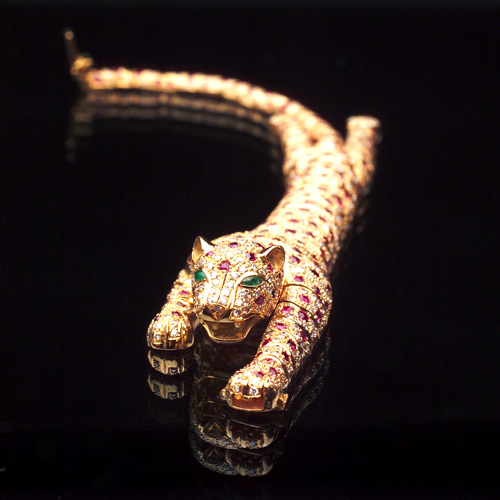 Appraisal: LAVIANNE Panther link bracelet with diamonds rubies and emeralds in