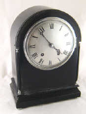 Appraisal: An eight day ebonised domed case mantel clock with chrome