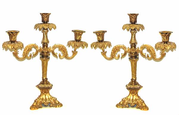 Appraisal: A pair of gilt three light girandoles lacking three bobeches