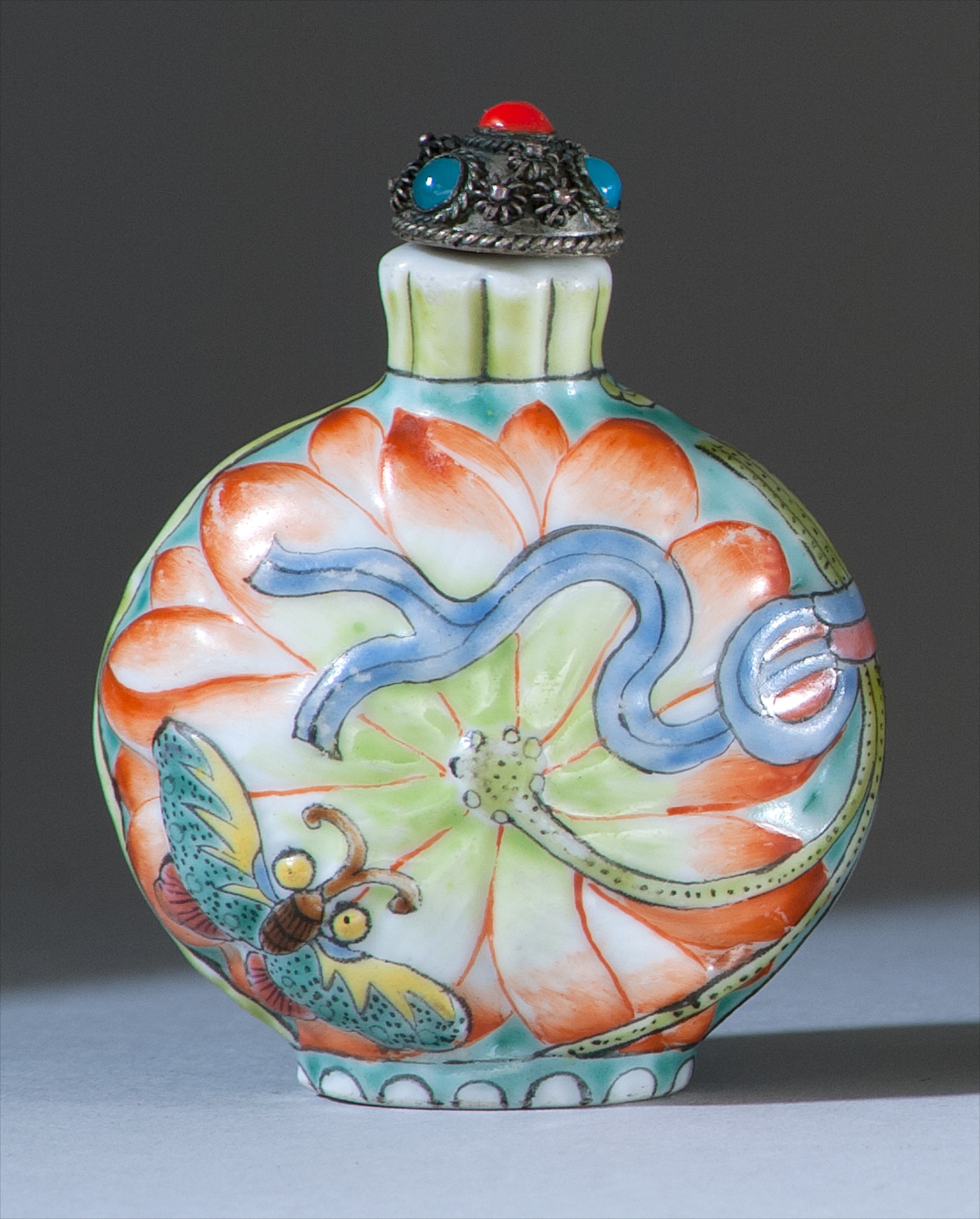 Appraisal: MOLDED PORCELAIN SNUFF BOTTLE Circa In ovoid form with lotus