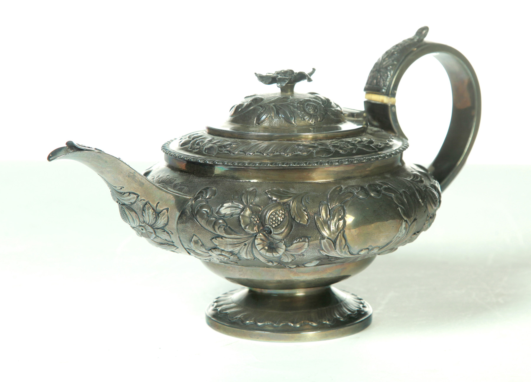 Appraisal: GEORGE IV CHASED STERLING TEAPOT London - Floral chasing separate