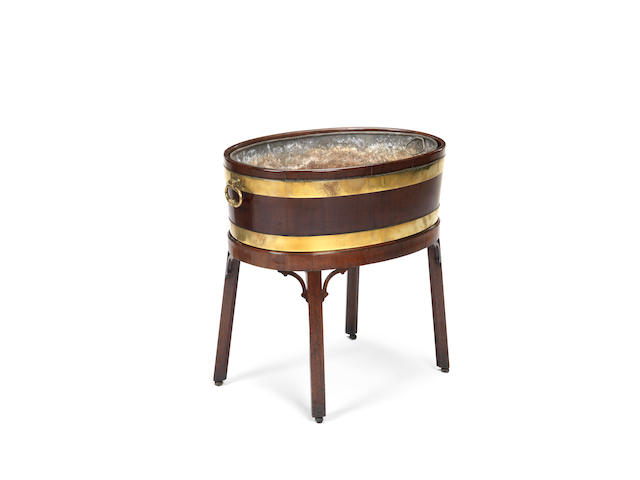 Appraisal: A George III brass bound mahogany wine cooler of oval