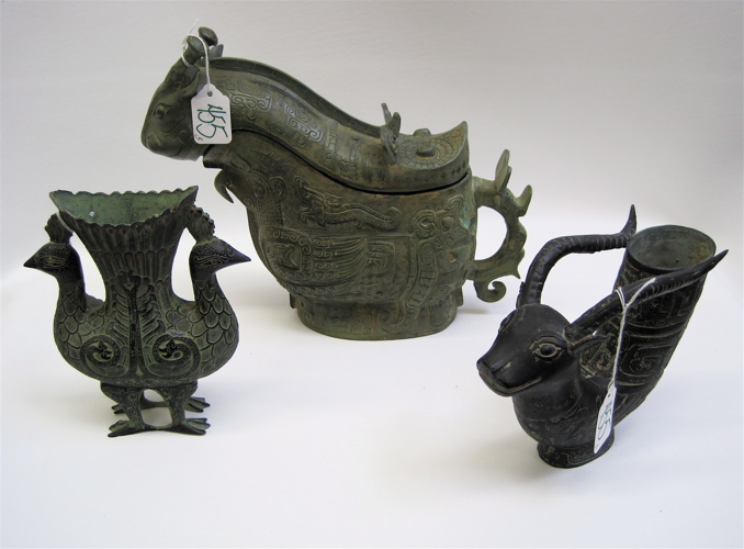 Appraisal: THREE CHINESE METAL PATINATED VESSELS various stylized creatures one with