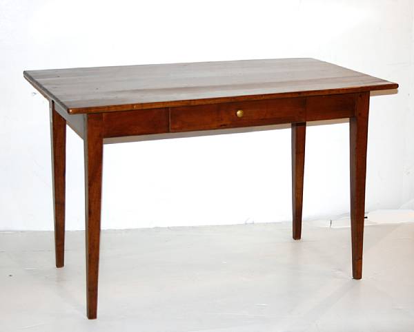 Appraisal: A French Provincial cherry writing table th century