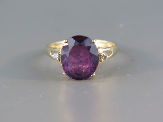 Appraisal: Amethyst and Diamond Ring vivid carat oval gem with diamond