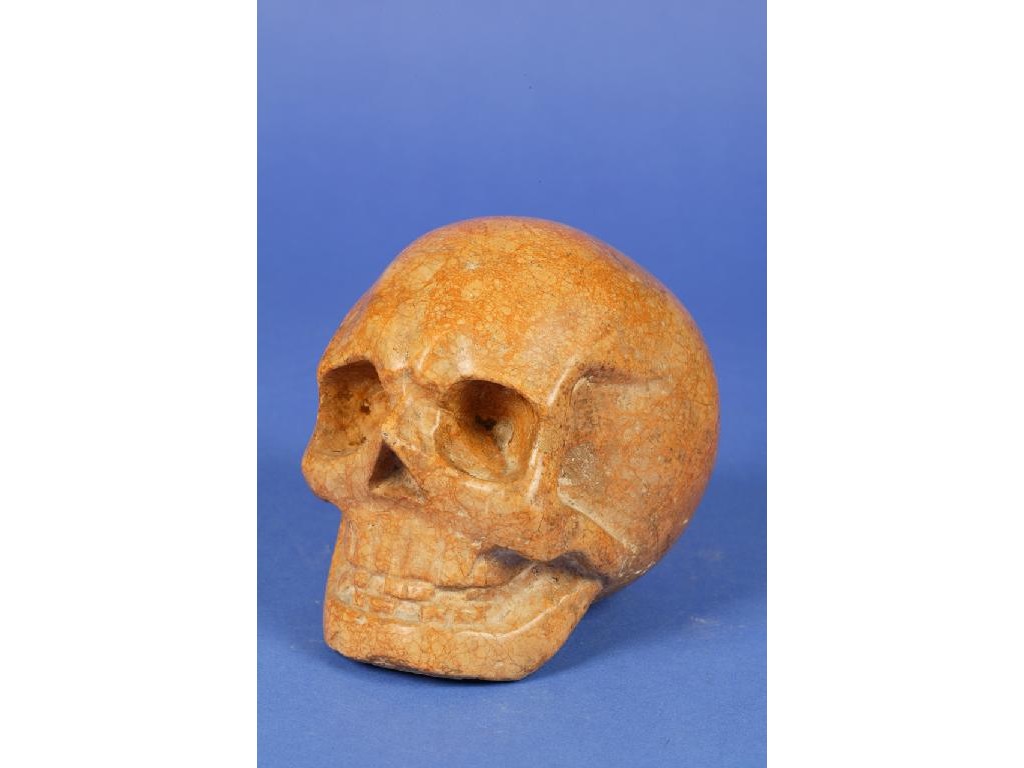 Appraisal: A FLEMISH MARBLE SKULL in mottled brown and buff coloured