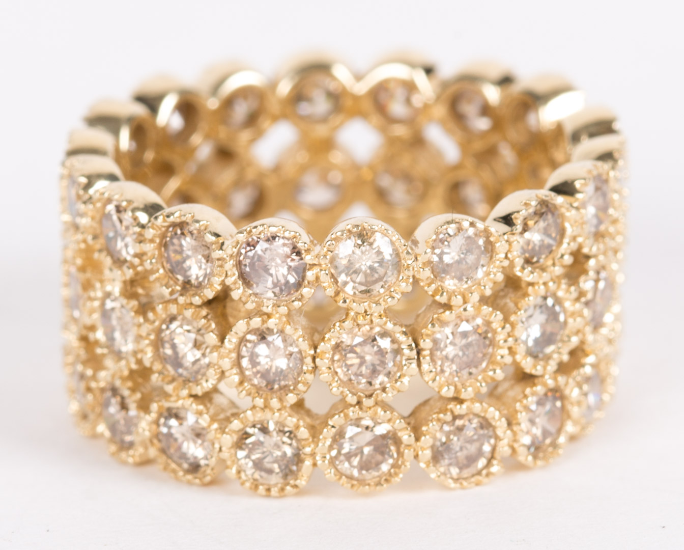 Appraisal: A Diamond Band set in kt yellow gold featuring three