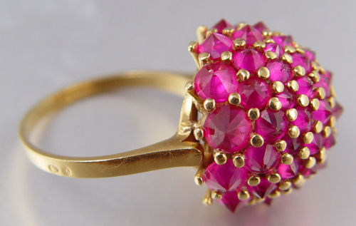 Appraisal: FRENCH K RUBY CLUSTER RING High profile K yellow gold