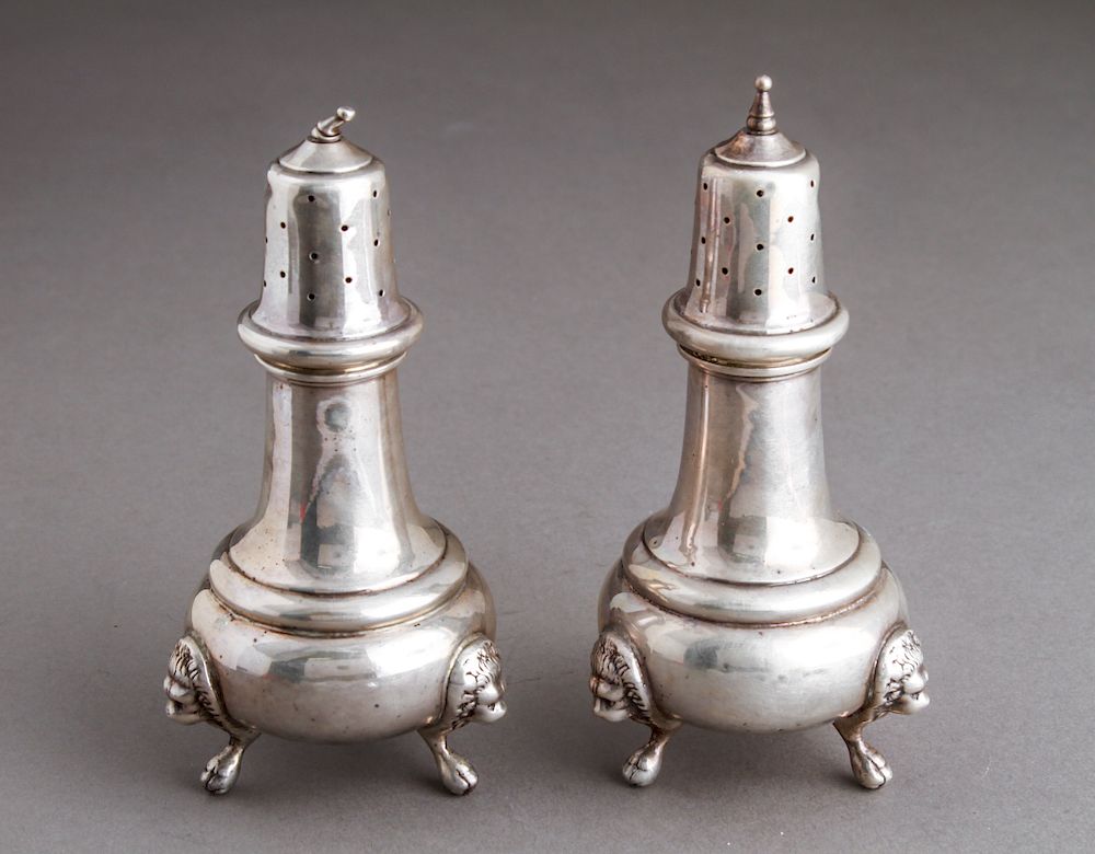 Appraisal: Sterling Silver Lion Head Paw Footed Shakers Pr Sterling silver