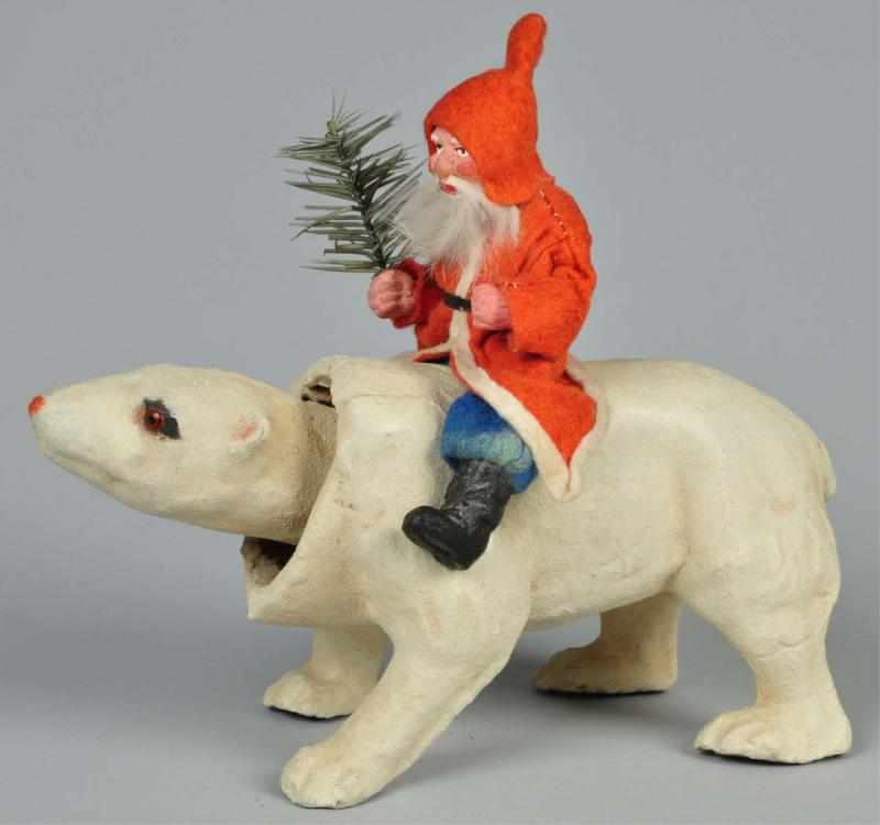 Appraisal: Santa Riding Mechanical Nodding Polar Bear Description Polar bear has