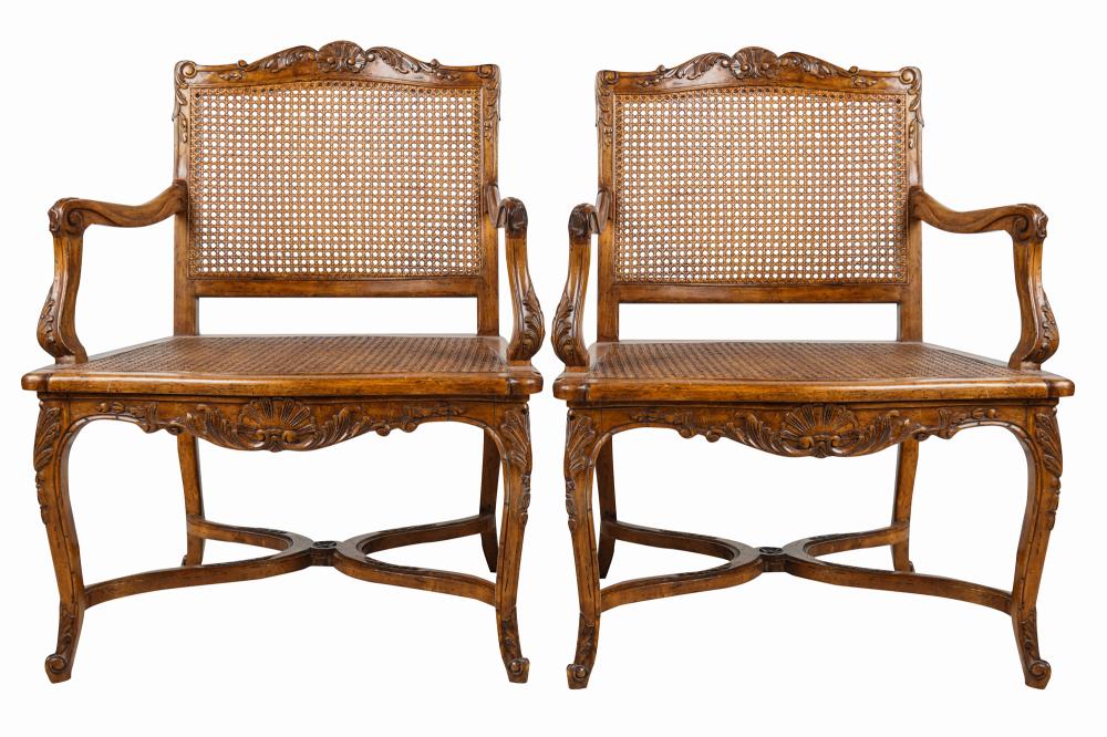 Appraisal: PAIR OF FRENCH PROVINCIAL STYLE OPEN ARMCHAIRSeach with caned seat