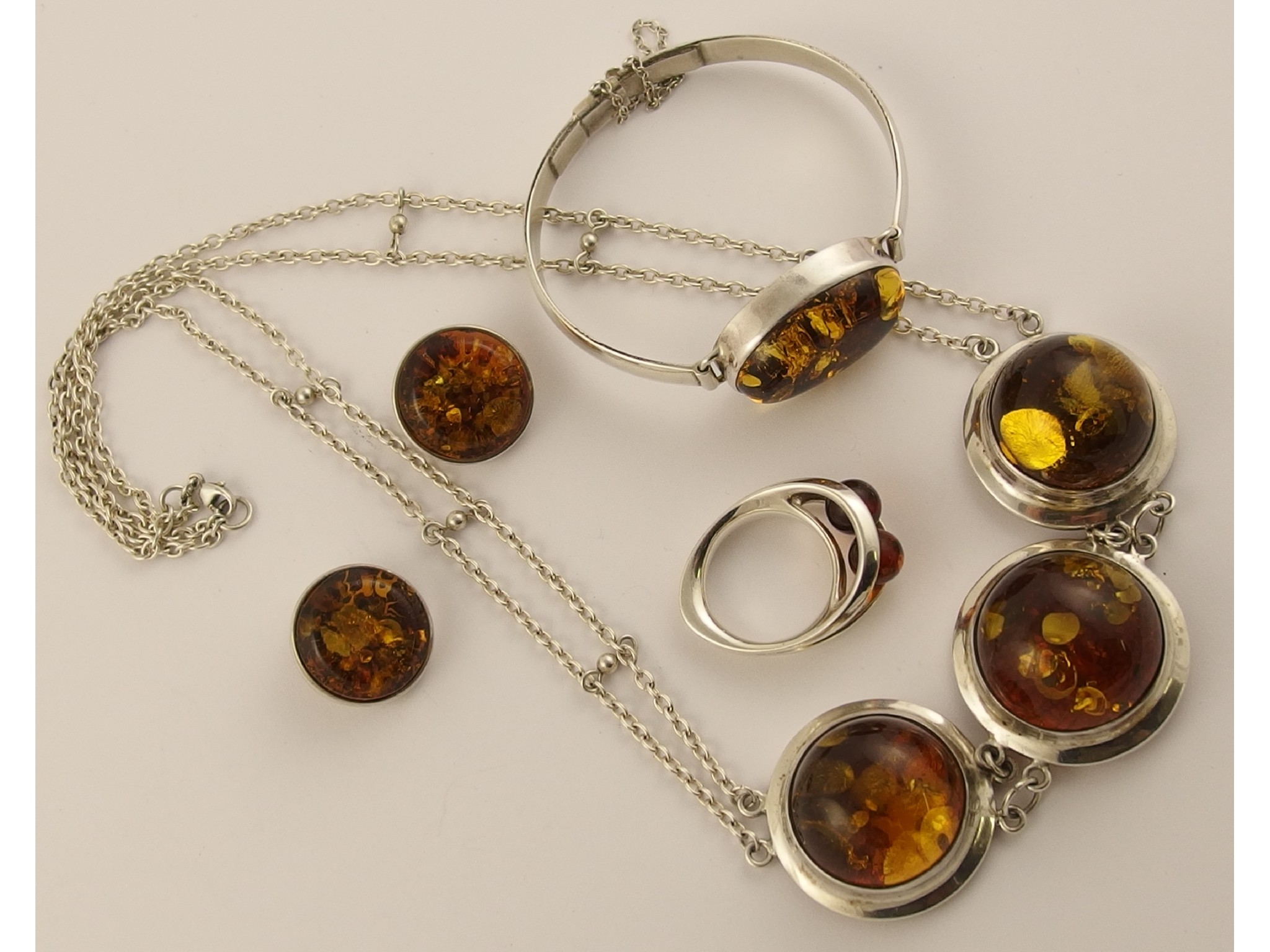 Appraisal: A suite of silver mounted amber coloured cabouchon jewellery comprising