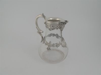 Appraisal: A Victorian mounted clear glass jug of baluster form with