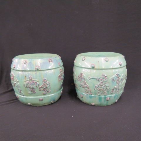 Appraisal: Pair of Oriental Pottery Garden Stools raised figures beautiful glaze