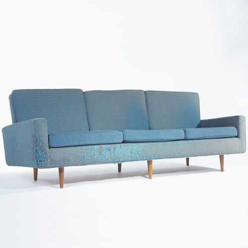 Appraisal: KNOLL Three-seat sofa with blue and amber upholstery on tapering