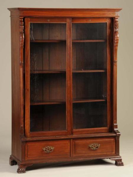 Appraisal: Victorian Mahogany Bookcase Description Circa Two glazed sliding doors enclosing