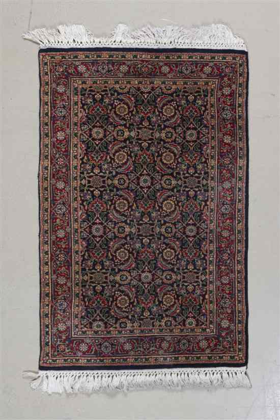 Appraisal: A Herati Wool Rug having allover foliate decoration on a