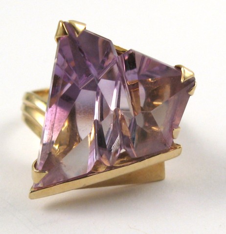 Appraisal: AMETHYST AND FOURTEEN KARAT GOLD RING set with a large