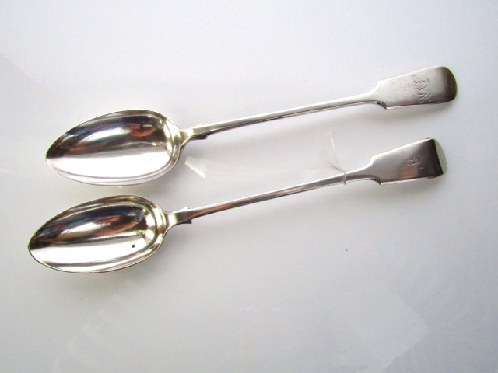 Appraisal: Two good quality silver plated monogrammed serving spoons one by