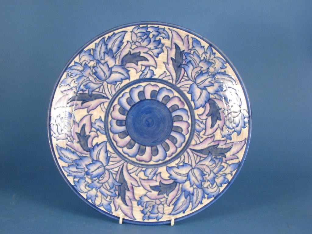 Appraisal: A Crown Ducal Charlotte Rhead Charger with blue and purple