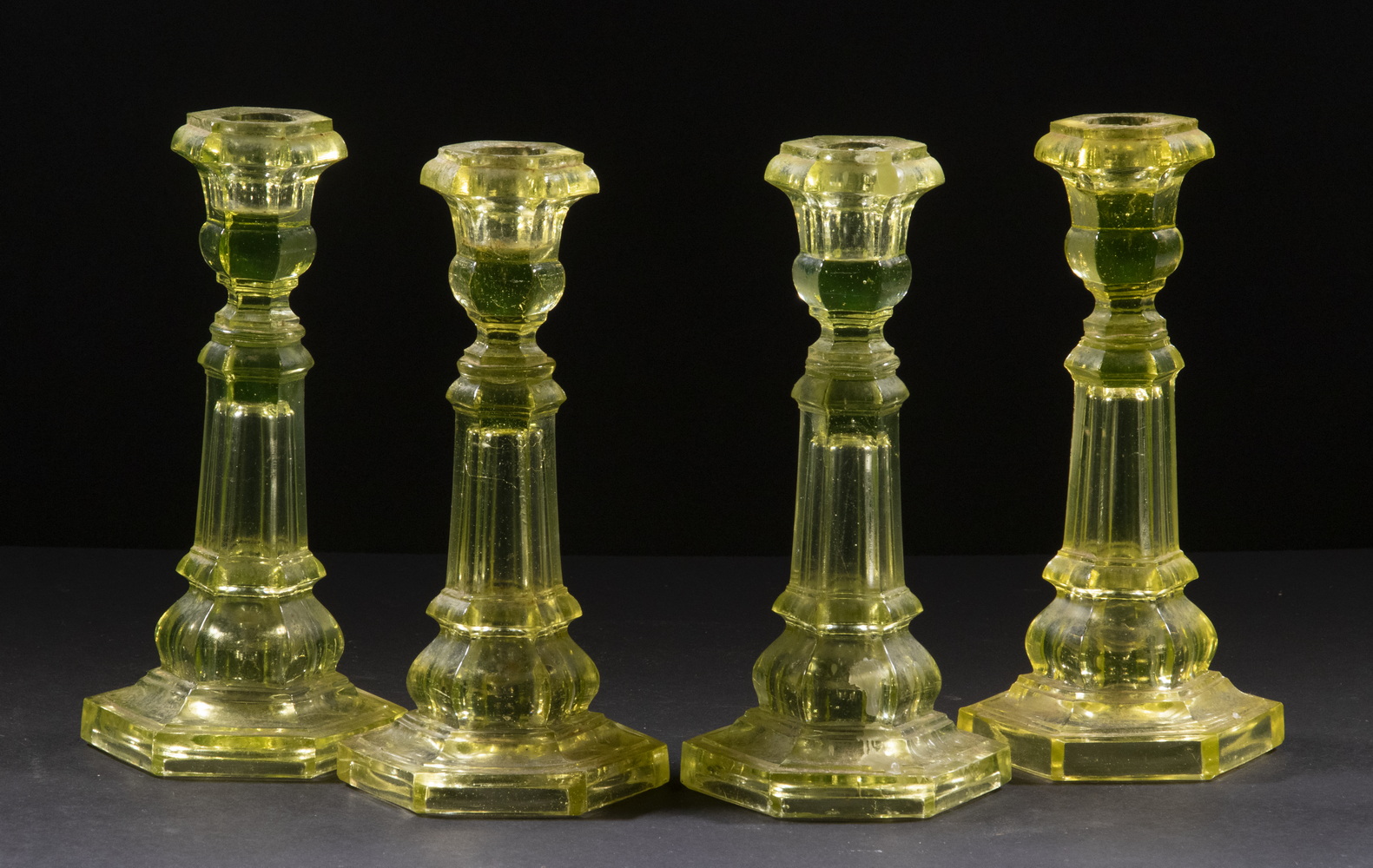 Appraisal: BOSTON SANDWICH VASELINE GLASS CANDLESTICKS Lot of th c Hexagonal