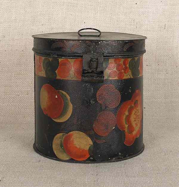 Appraisal: Black tole lidded canister th c with polychrome fruit and