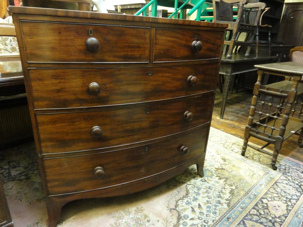 Appraisal: An early th century mahogany bow fronted chest fitted with