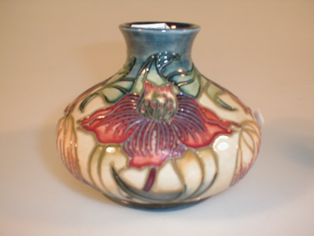 Appraisal: A small modern Moorcroft globular squat glass decoration with crown