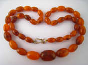 Appraisal: An amber necklace approx cm long largest bead approx cm